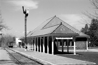 Old-Fashioned Railroad Signal at the Train Depot, Orchard Park, NY. An old-fashioned black and white analog photograph captured with a 35mm Pentax Spotmatic camera on Kodak T-Max 100 negative film.