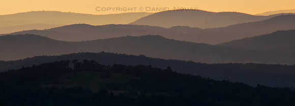 Sunset over Green Mountains from Rumrunners' Hideaway, layers of distant ridges in haze, Vermont (VT)