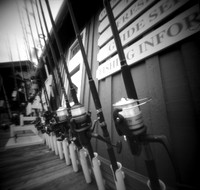 Fishing Rods, town boardwalk, Duck, NC. TerraPin ACME 3d-printed pinhole camera, Kodak T-Max 100 black and white negative film. replenished D-23 developer.