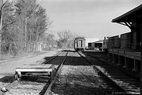 Tracks behind the Train Depot, Orchard Park, NY. Photographed with a 35mm Pentax Spotmatic F on Ilford XP2 black and white film.