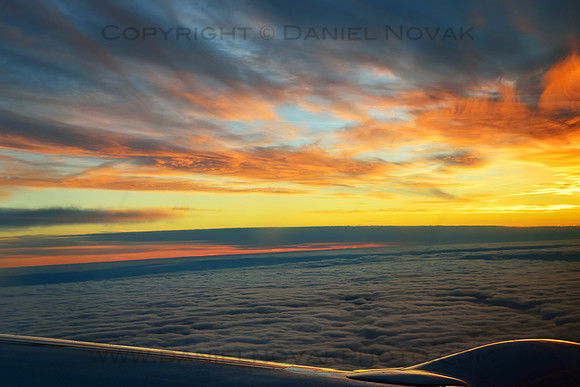 Wild Colorful Sunset above Clouds