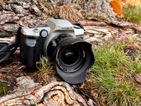 35mm Minolta Maxxum 5 film camera with an AF 24mm f/2.8 lens and lenshood.