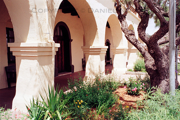 Colonnade Arches, Santa Ines Mission, Solvang, California. Photographed with a.vintage 35mm Olympus Stylus Zoom 140 camera on Kodak Colorplus 200 color negative film. Developed in C-41.