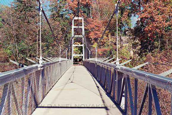 Suspension Bridge over Fall Creek, Ithaca, NY. Photographed with a vintage 35mm Minolta Maxxum 5 camera on Kodak Colorplus 200 color negative film. Developed in C-41.