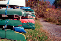 Canoes by Trail, Beebe Lake, Ithaca, NY. Photographed with a vintage 35mm Minolta Maxxum 5 camera on Kodak Colorplus 200 color negative film. Developed in C-41.
