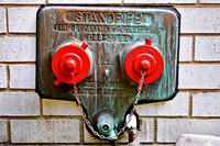 New York City Fire Department Standpipe - Red, Green, Brick Wall.