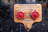 New York City Fire Department Standpipe - Gold and Red in Marble.