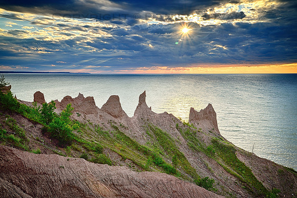 Sunset over Rocky Spires of Chimney Bluffs, Sodus Bay, Huron, northeast of Rochester, New York (NY).