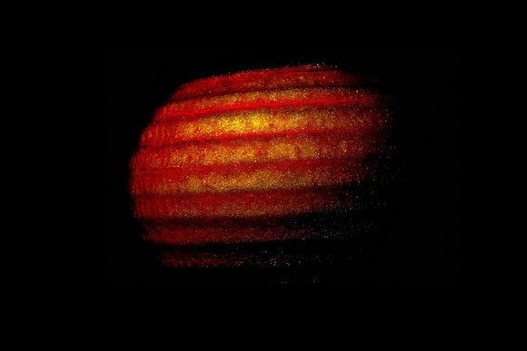 A New Planet Abstract, a Dark and Contrasty Machine Peeled Apple.