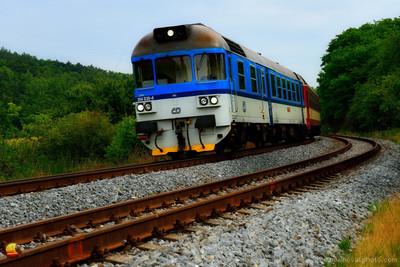 Banking through the Turn, local train in a banked curve on the Brno - Uhersky Brod route near the village of Nemotice in Southern Moravia, Czech Republic