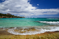 Waves Spilling on Shipwreck Beach, South Shore Kauai, Hawaii.