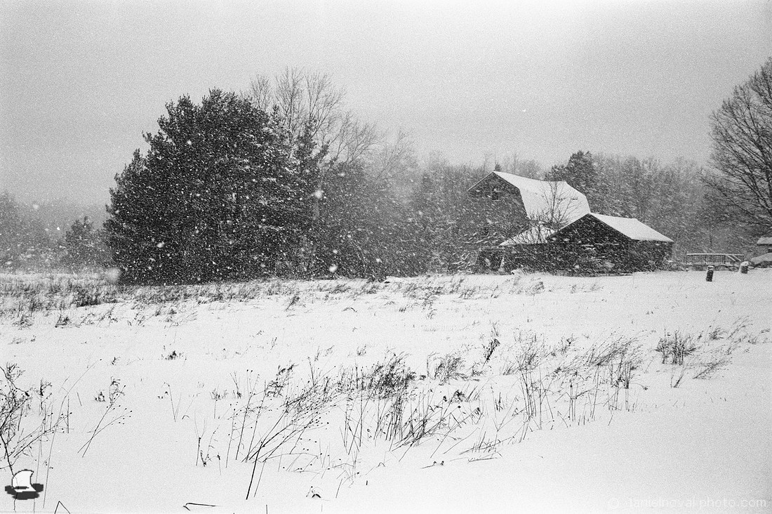 Snowstorm over Three Roofs, Clouds rolled in, obstructed the sun, and unleashed one of many Western New York's winter scenes.
