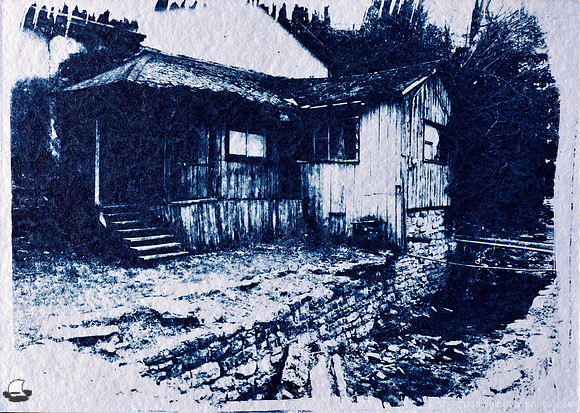 An old house by a train station. An original hand-made 5" x 7" cyanotype print from Eureka Springs, Arkansas.