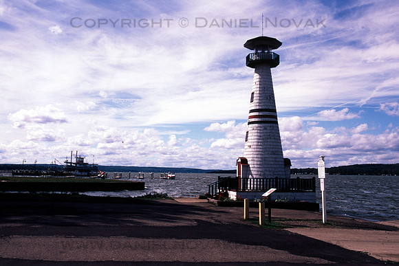 Celoron Lighthouse in Color near Jamestown, NY. Chautauqua Belle in the background. Nikon N75 and Fujichrome Velvia.