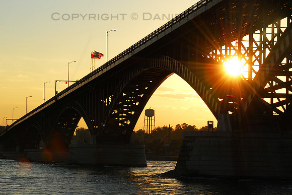 Sunset through Peace Bridge over the Niagara River connecting Buffalo, NY on the American side and Fort Erie on the Canadian side.