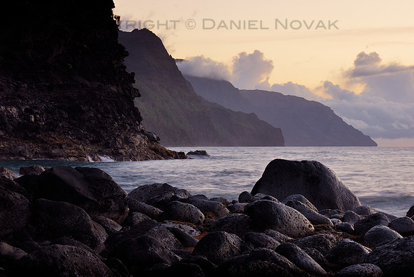 Sunset on rocks by Ke'e Beach, Cliffs of Na Pali Coast, North Shore Kauai, Hawaii (HI).
