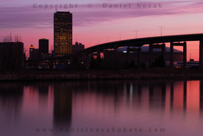 Time can make quite a difference. Buffalo skyline and Skyway at dawn, skyline reflection.
