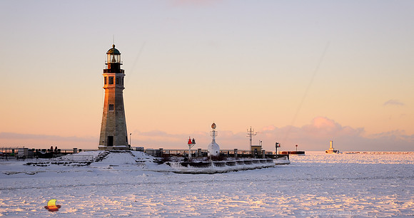Kiss of Light on Buffalo Main Light, Winter Sunrise on Waterfront, Erie Basin Marina, Buffalo, New York (NY).