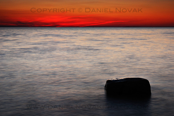 Deep red sky after a sunset over Lake Erie at the mouth of Eighteen Mile Creek, New York (NY).