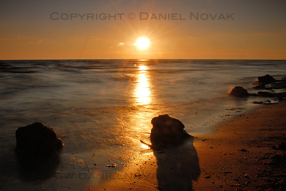 Sunset over Woodlawn Beach State Park, Hamburg / buffalo, New York (NY). Direct sun low over horizon.