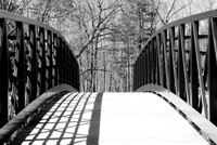 Shadows on the Fishing Pier, Green Lake, Yates Park, Orchard Park, NY. An old-fashioned black and white analog photograph captured with a 35mm Pentax Spotmatic camera on Kodak T-Max 100 negative film.